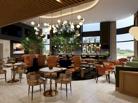 This image shows a modern restaurant interior with stylish seating, plants, and ambient lighting, creating an inviting and chic atmosphere.
