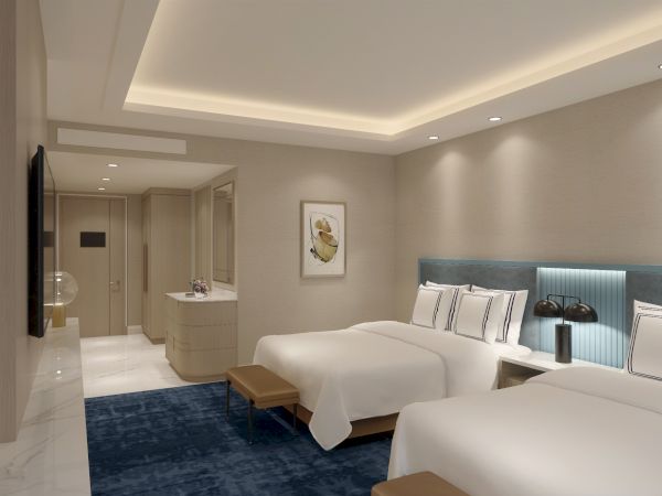 A modern hotel room with two beds, a blue carpet, soft lighting, and minimalist decor including a wall art piece and a small lamp.