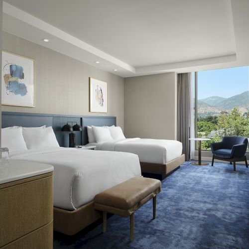 Two queen guest room at Hilton Arcadia Pasadena Area with mountain views