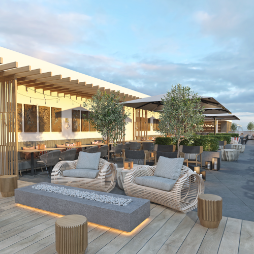 A modern rooftop terrace with sofas, chairs, tables, and potted trees, offering a scenic view under a partly cloudy sky.