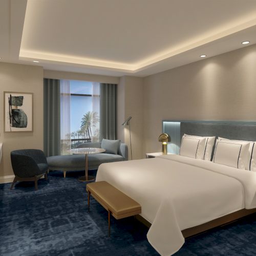 A modern hotel room with a double bed, armchair, large window, and carpet. The room features stylish lighting and decor.