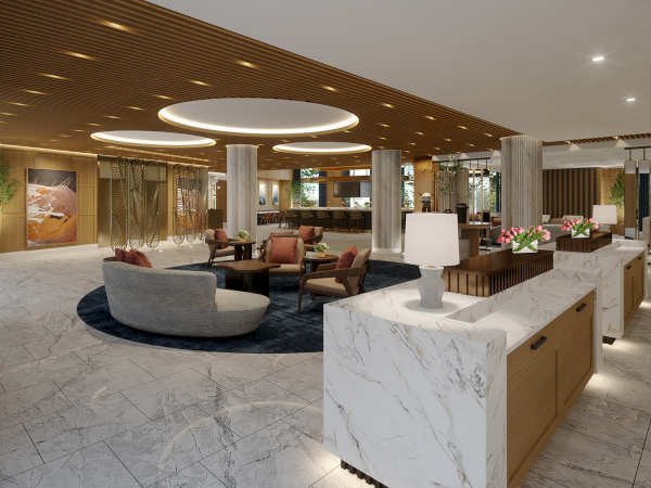 The image shows a modern hotel lobby with marble floors, seating areas, and decorative lighting, creating an elegant and inviting atmosphere.
