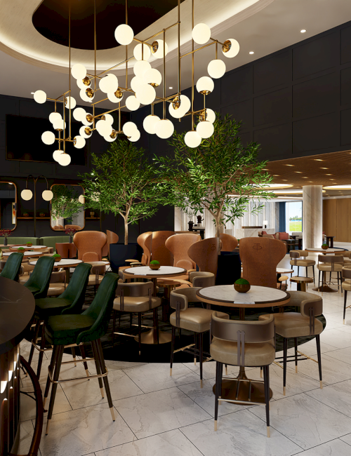 The image shows a modern, stylish restaurant with elegant lighting, green chairs, and round tables, featuring indoor plants and a cozy ambiance.